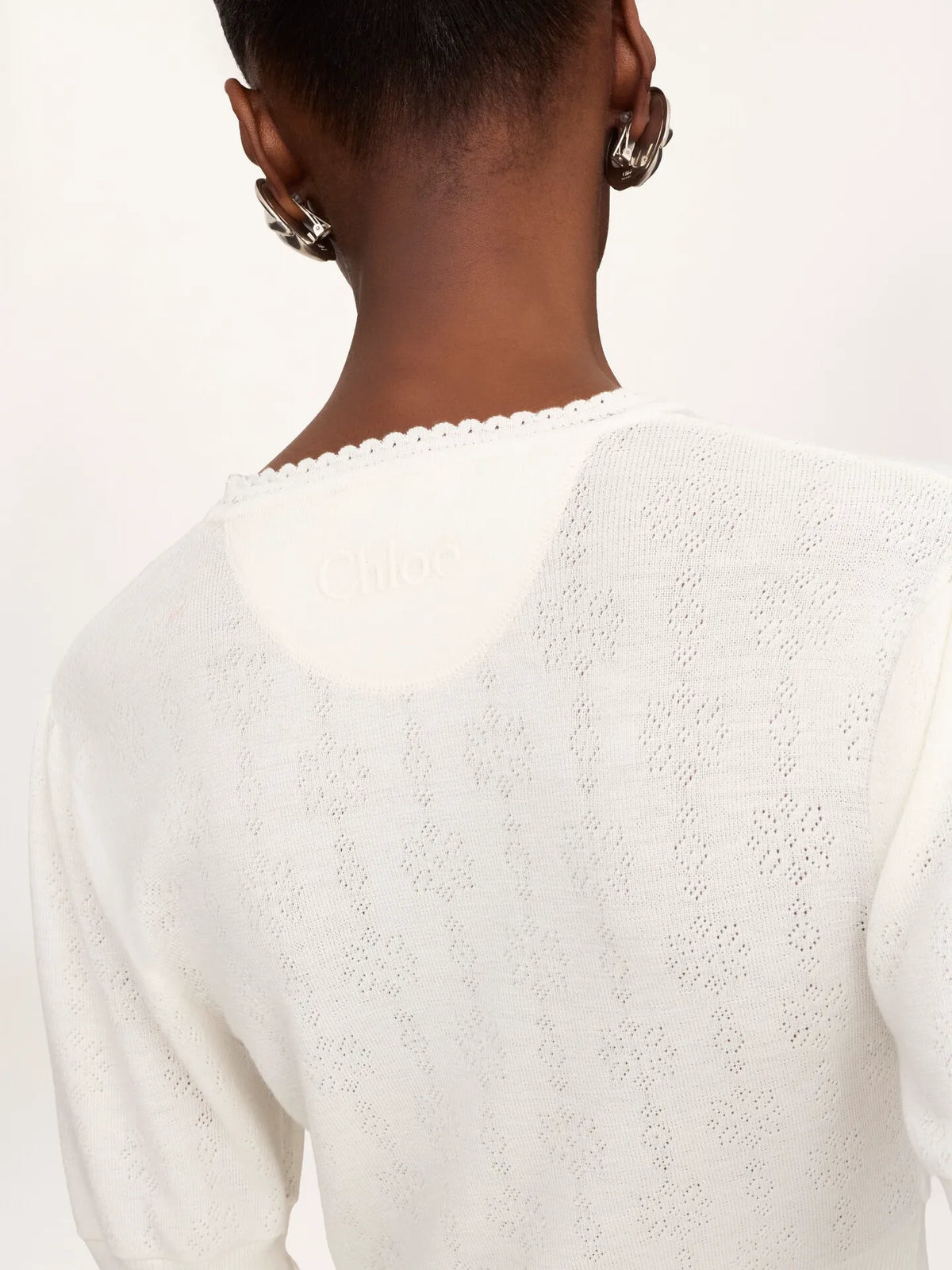 Cropped ruffle sweater in a wool knit