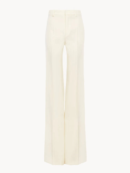 High-rise flared pants in wool grain de poudre