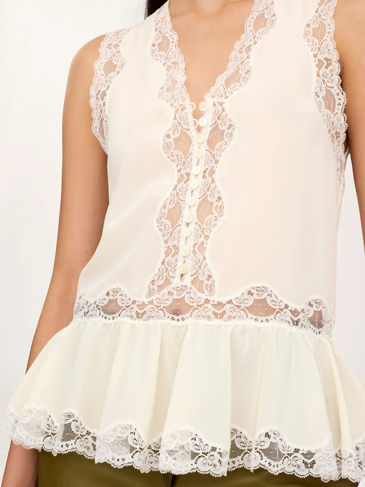Sleeveless peplum top in crêpe de chine & lace