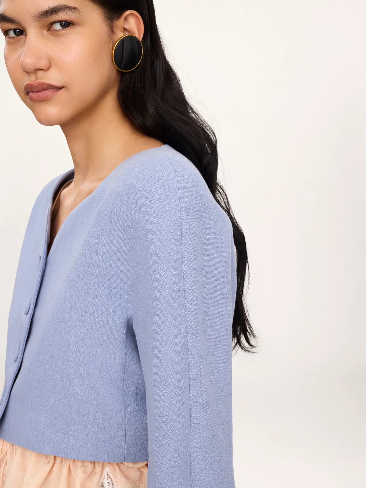 Cropped collarless jacket in linen crêpe