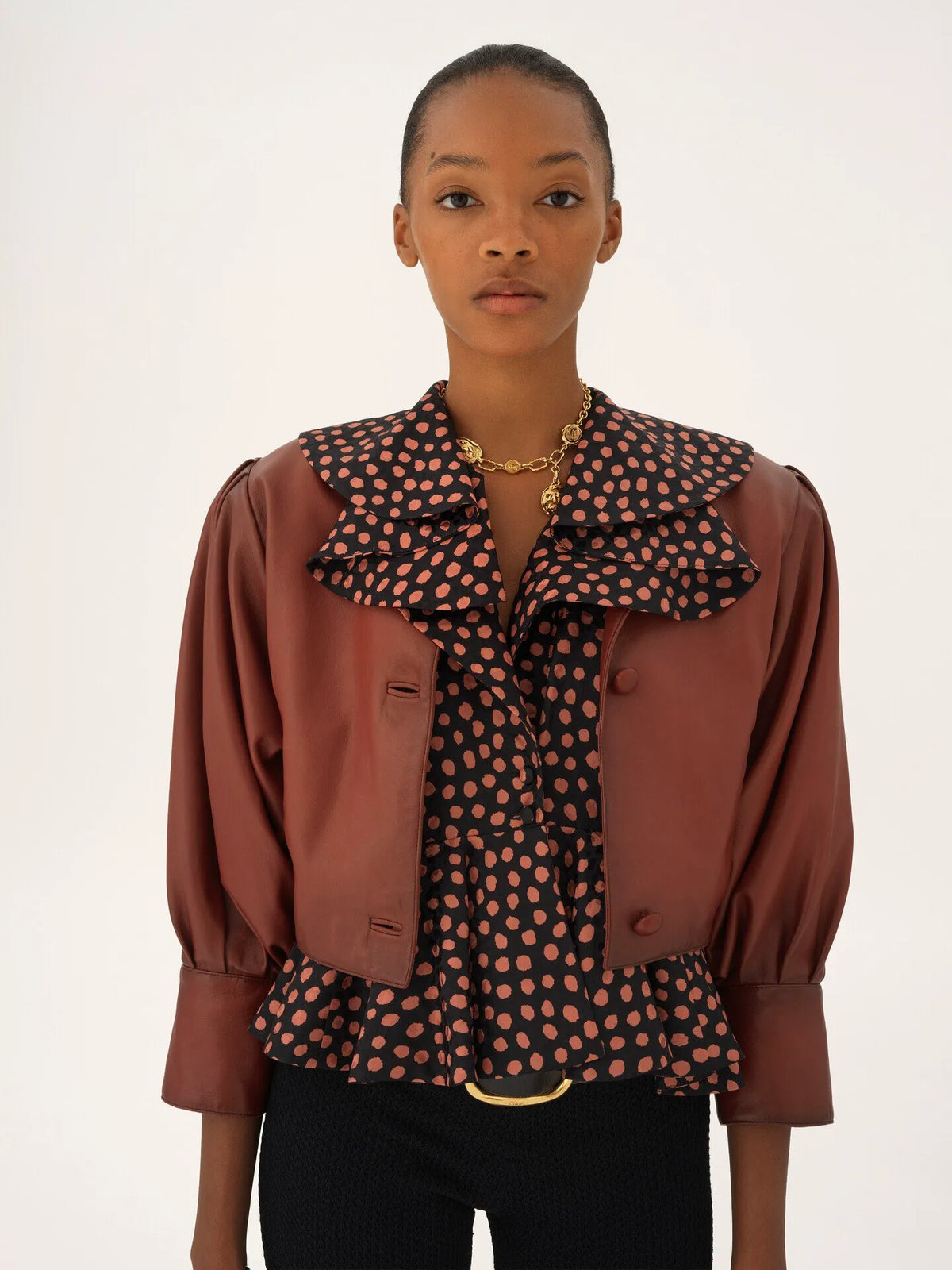 Cropped collarless jacket in leather