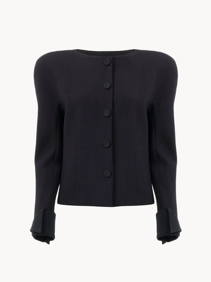 Collarless fitted jacket in wool crêpe