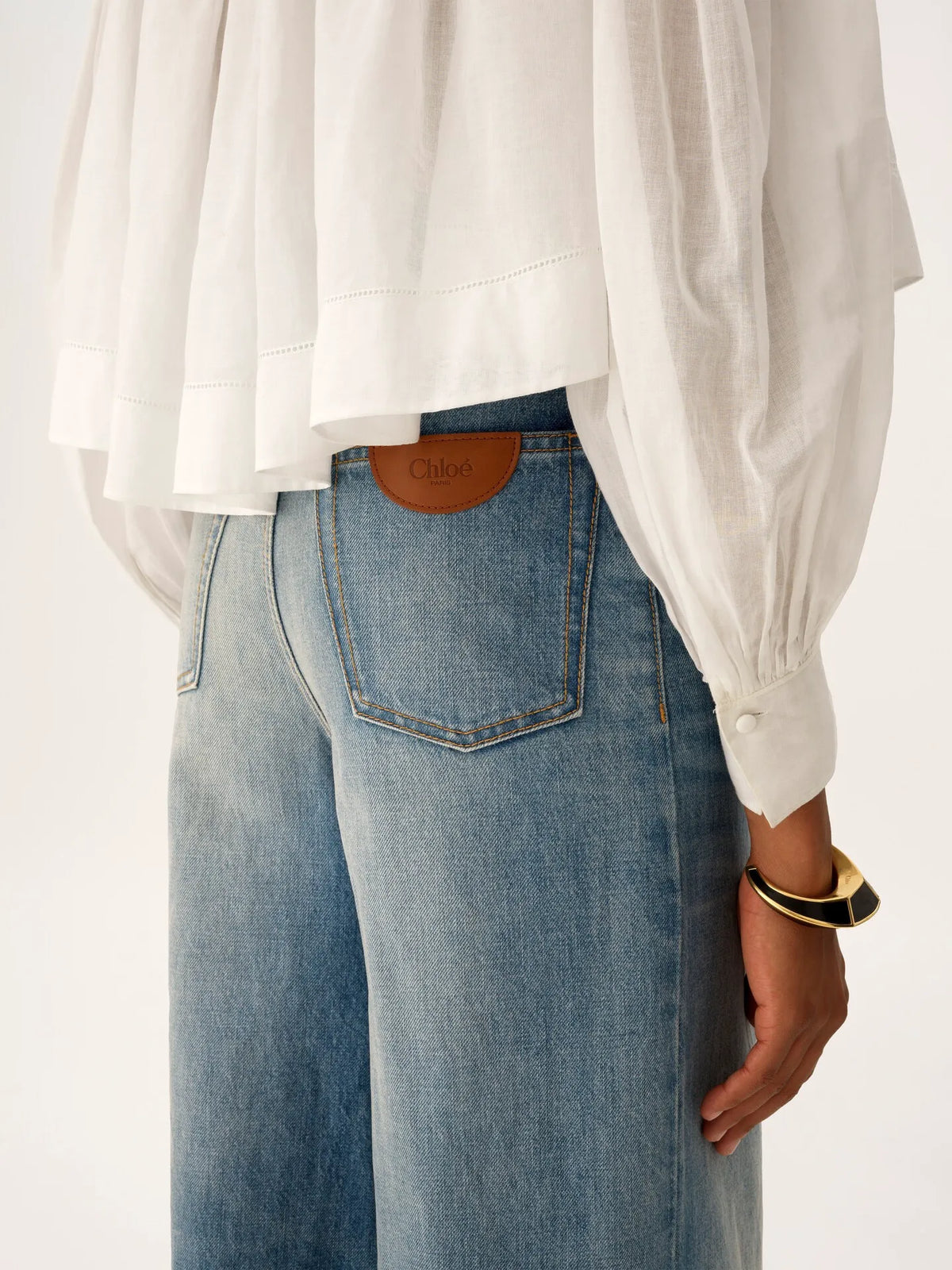 High-rise wide-leg jeans in denim