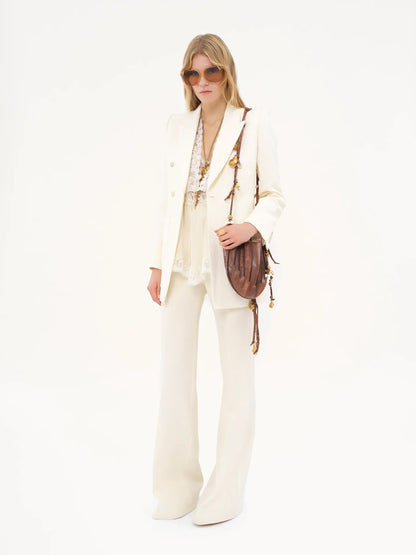 High-rise flared pants in wool grain de poudre