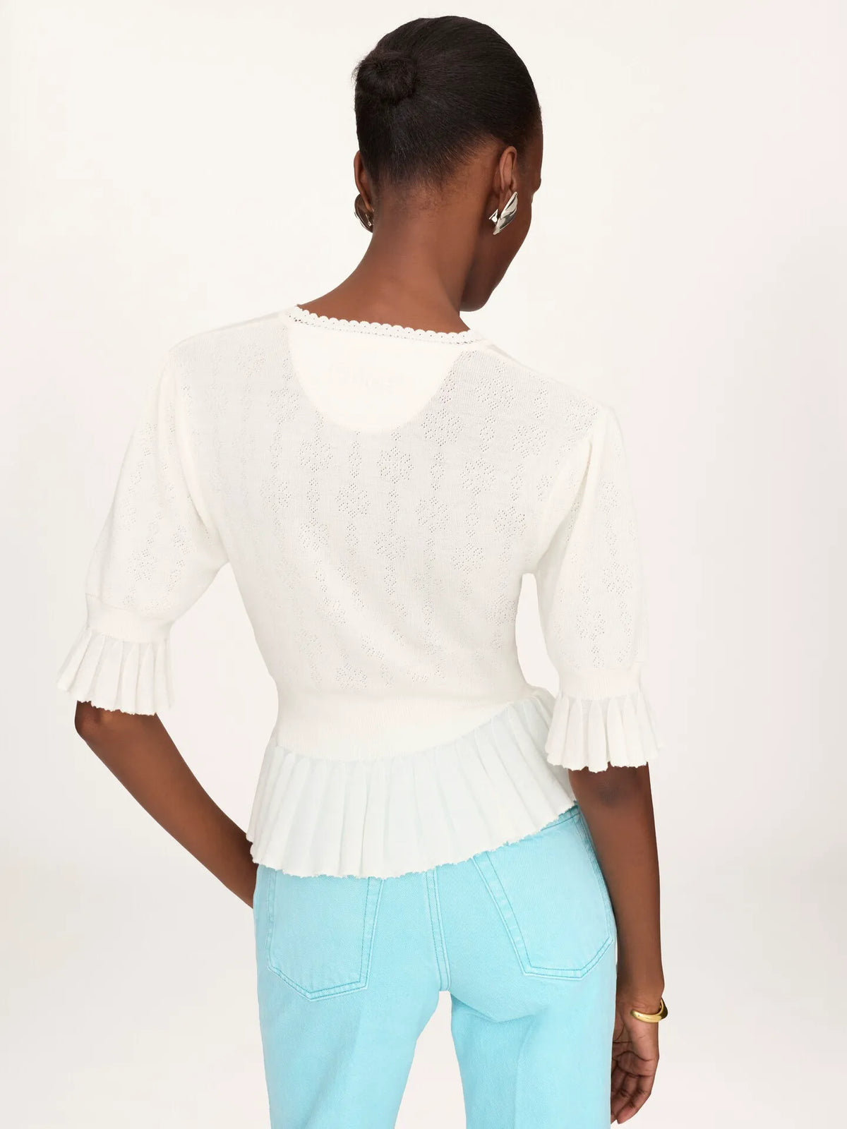 Cropped ruffle sweater in a wool knit