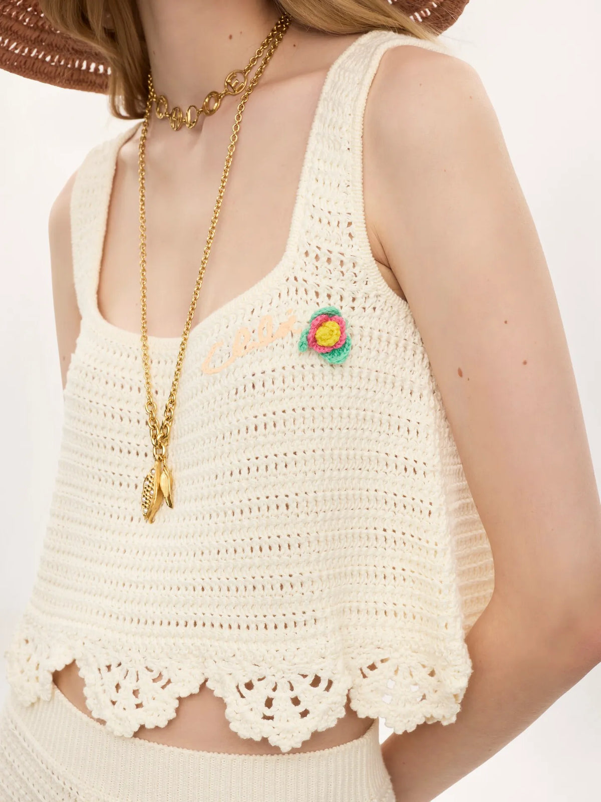 Sleeveless cropped top in crochet knit